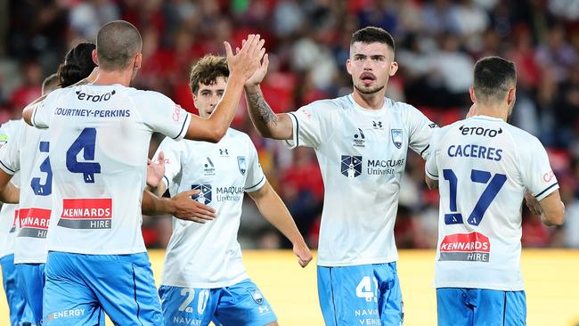 ADELAIDE, AUSTRALIA - DECEMBER 20: Alexandar Popovic of Sydney FC congratulates Jordan Courtney-Perkins of Sydney FC on his goal during the round nine A-League Men match between Adelaide United and Sydney FC at Coopers Stadium, on December 20, 2024, in Adelaide, Australia. (Photo by Sarah Reed/Getty Images)