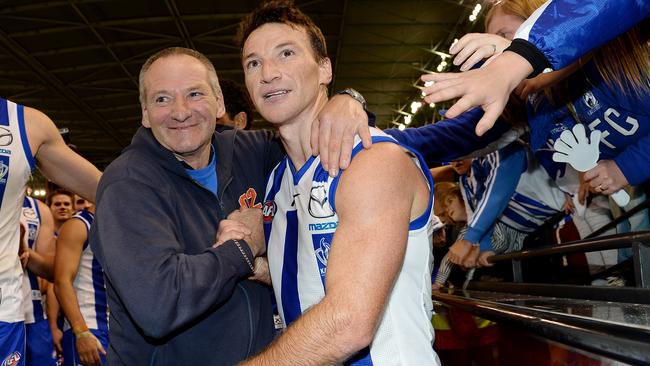 Neil Harvey and Brent Harvey after a win in 2013. Picture: Colleen Petch