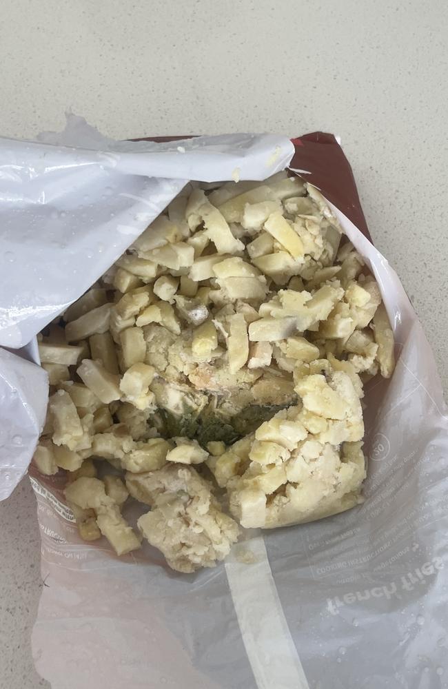 The frozen chips were warm when they were picked up from Hope Island Marketplace Woolworths on Tuesday morning, and inside they were a “mashed and mouldy mess.” Picture: supplied.