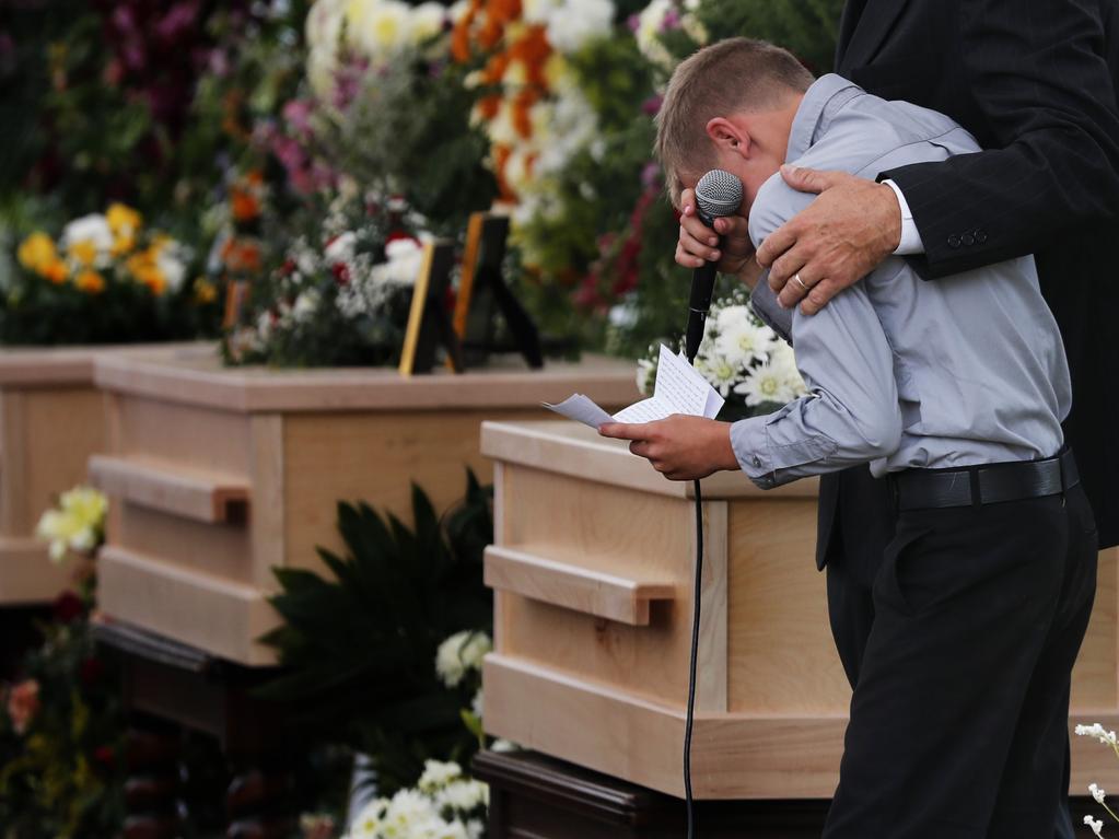 One of Ms Langford’s sons pauses as he speaks at his mum and brothers’ funeral. Picture: Marco Ugarte/AP