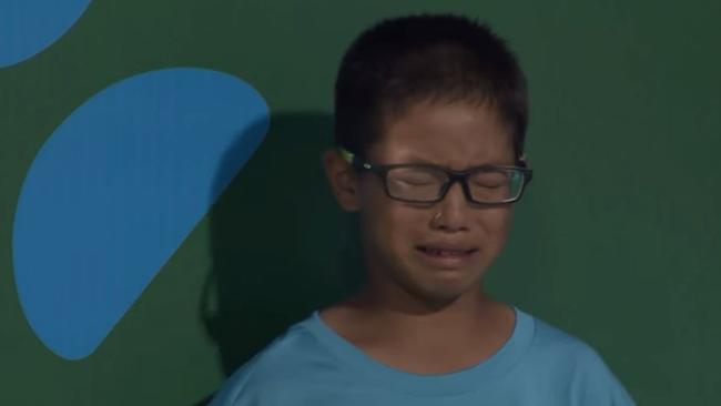The unlucky ball boy copped a powerful serve in the stomach.