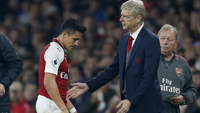 Arsenal's French manager Arsene Wenger gestures as Arsenal's Chilean striker Alexis Sanchez.