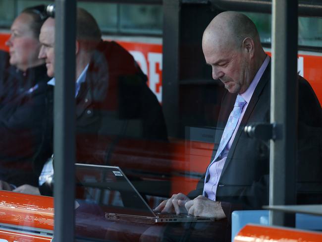 Herald Sun chief football writer Mark Robinson working from the bench. Picture: Sarah Reed