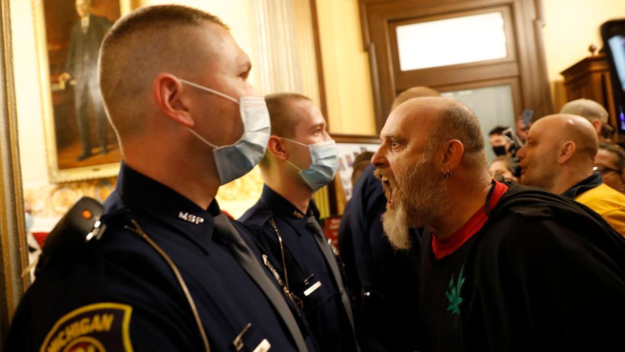 Armed anti-lockdown protesters storm the Michigan House of Representative. Picture: AFP