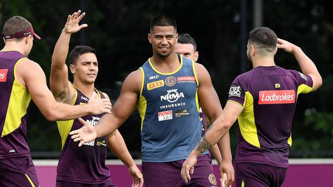 Payne Haas (centre) with fellow Broncos players at a training session at Red Hill. Picture: AAP/Dave Hunt