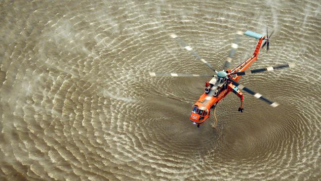 Elvis the Aircrane fills up with water during a recent fire. Helicopter.