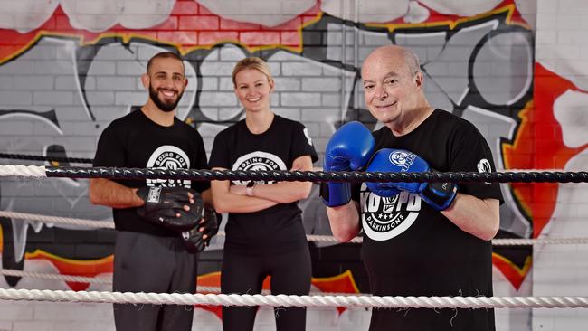 Carioti MMA owners Alex and Kim Carioti with Parkinson's sufferer and founder of Knock Out Parkinson’s Disease Adrian Unger (right). Picture: Troy Snook