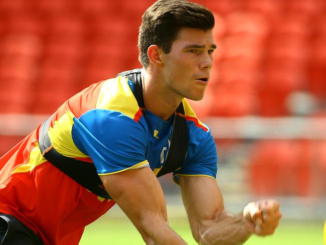 Gold Coast Suns training in the morning heat at Metricon Stadium - Pictured is Jaeger O'Meara Pic by David Clark