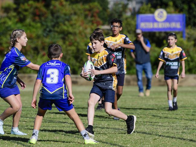 Bailey Brooks of Rockville State School takes the ball up against Glenvale State School in the inaugural Primary Interschools Reconciliation Touch Carnival hosted by Glenvale State School, Wednesday, May 28, 2025. Picture: Kevin Farmer