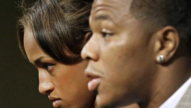 Janay Rice, left, looks on as her husband, Baltimore Ravens running back Ray Rice, speaks to the media during a news conference.