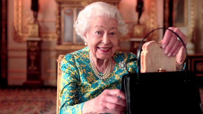 The Queen and Paddington Bear enjoy a maamalade sandwich during the Platinum Party at the Palace for the 70th Jubilee. Supplied