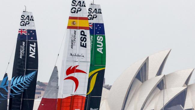 The crews of Team New Zealand, Team Spain and Team Australia sail in front of the Sydney Opera House during the first day of racing in the Sail Grand Prix event on Sydney Harbour on February 24, 2024. (Photo by DAVID GRAY / AFP) / -- IMAGE RESTRICTED TO EDITORIAL USE - STRICTLY NO COMMERCIAL USE --