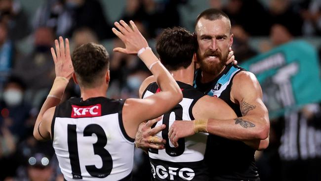 Port Adelaide stormed home in the second half to rout the Blues.