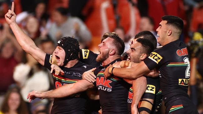 Kurt Capewell celebrates with Panthers teammates after scoring a try against Melbourne Storm. Picture: Cameron Spencer/Getty Images