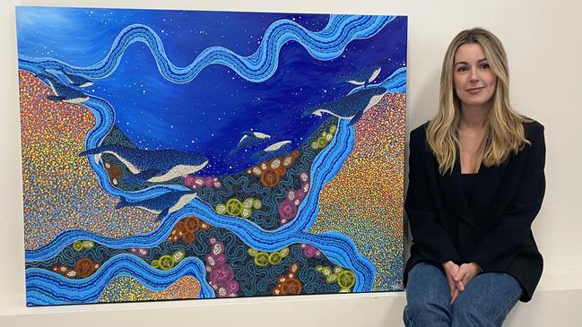 Northern beaches artist Skye Burton with her “Yirbamagi Gadhang” artwork created for Royal Far West’s Budgy Smuggler fundraising swimwear range. Picture: Supplied