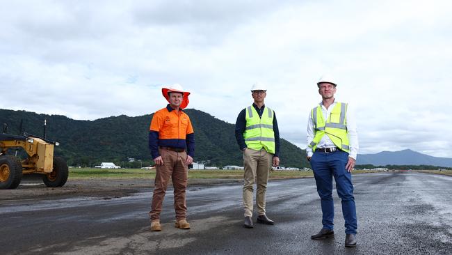 Construction on the Cairns Airport's eastern aviation precinct has begun, with initial earthmoving work underway at the site of the old runway, south of the domestic terminal. HEH Civil director Luke Bird, North Queensland Airports chief executive Richard Barker and general manager of infrastructure and property Alan Dugan inspect the site of the new precinct, which will house purpose-built infrastructure and facilities, and expand the airport's general aviation footprint. Picture: Brendan Radke