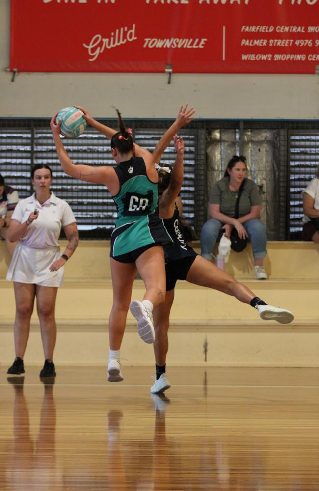 Netball action from QISSN 2024, Townsville. Canterbury's Aaliyah Frescon-Sheppard clashes with Matthew Flinders' GD