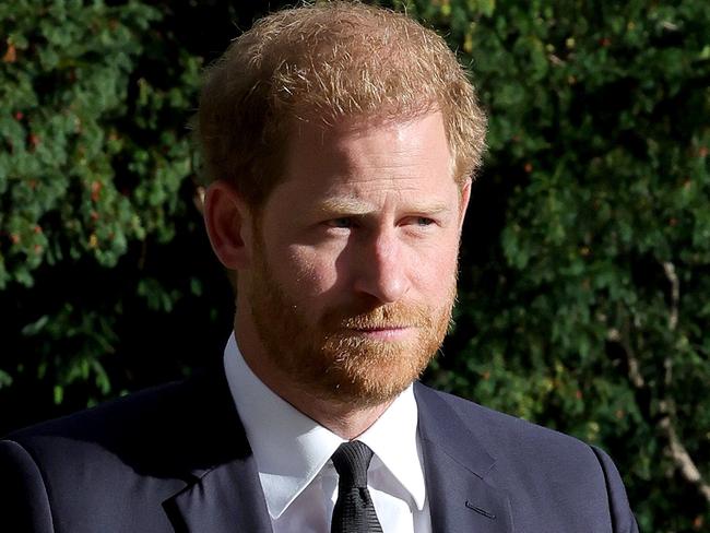 WINDSOR, ENGLAND - SEPTEMBER 10: Prince Harry, Duke of Sussex, and Meghan, Duchess of Sussex on the long Walk at Windsor Castle arrive to view flowers and tributes to HM Queen Elizabeth on September 10, 2022 in Windsor, England. Crowds have gathered and tributes left at the gates of Windsor Castle to Queen Elizabeth II, who died at Balmoral Castle on 8 September, 2022. (Photo by Chris Jackson/Getty Images)