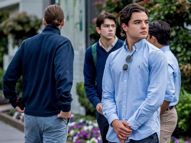 Students arrive to school in neat casual dress to protest the sacking of their deputy headmaster. Picture: Jake Nowakowski