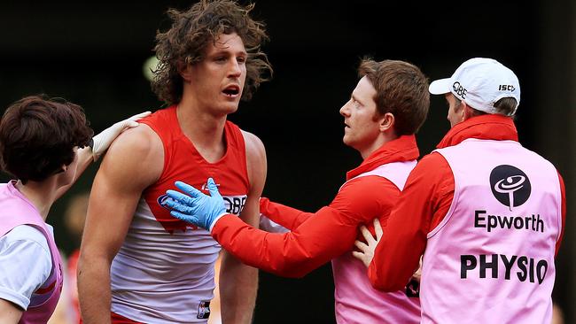 Kurt Tippett gets up after a big hit. Picture: Toby Zerna