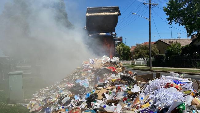 Cleanaway had to quickly dump a “hot load” of recycling on the side of the road in Adelaide when a battery started a fire inside the truck. Picture: Supplied.