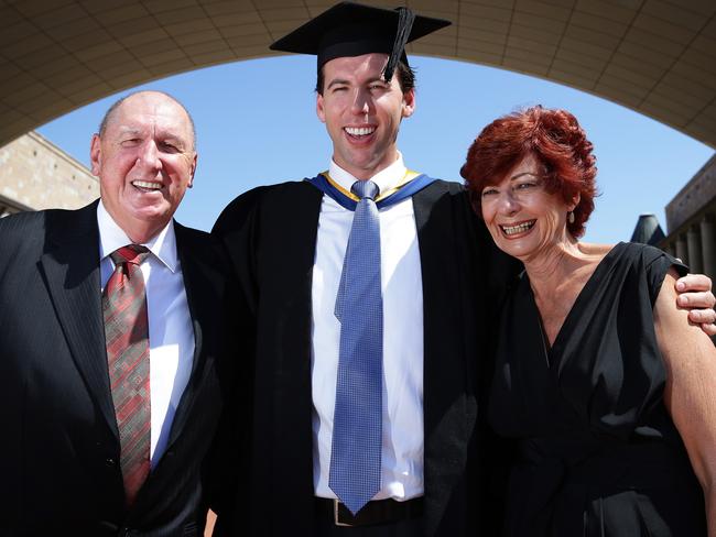 Hackett with his parents Neville and Margaret after graduating from Bond University on the Gold Coast in 2012. Picture: Adam Head