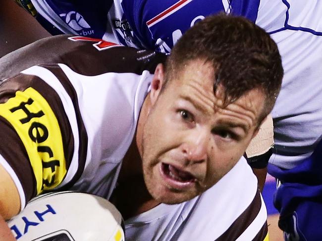 SYDNEY, AUSTRALIA - MARCH 10: Trent Merrin of the Panthers is tackled during the round two NRL match between the Penrith Panthers and the Canterbury Bulldogs at Pepper Stadium on March 10, 2016 in Sydney, Australia. (Photo by Matt King/Getty Images)