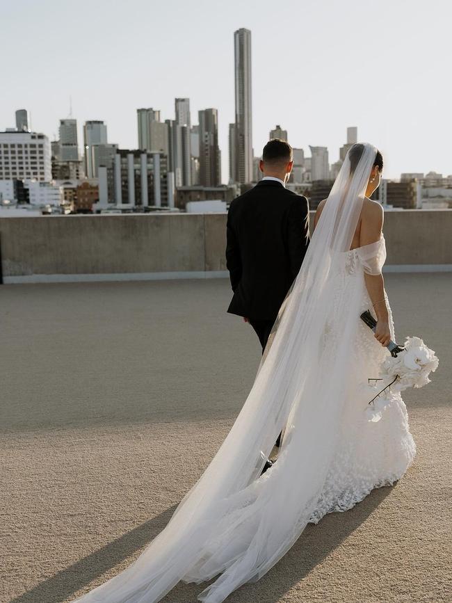 For the ceremony, De Marco wore a detailed off-the-shoulder mermaid silhouette gown complemented by a cathedral-length veil. Photo: Instagram.