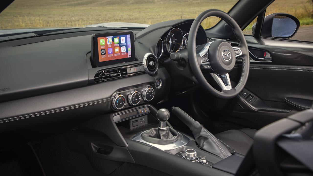 The latest MX-5 has a touchscreen with Apple CarPlay.