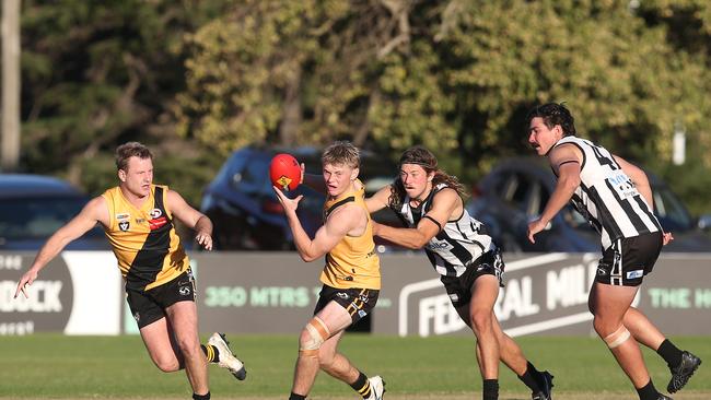 Bannockburn's Austin Mahoney tries to break away from North Geelong's Rory Desnoy. GDFNL North Geelong v Bannockburn. Picture: Alan Barber