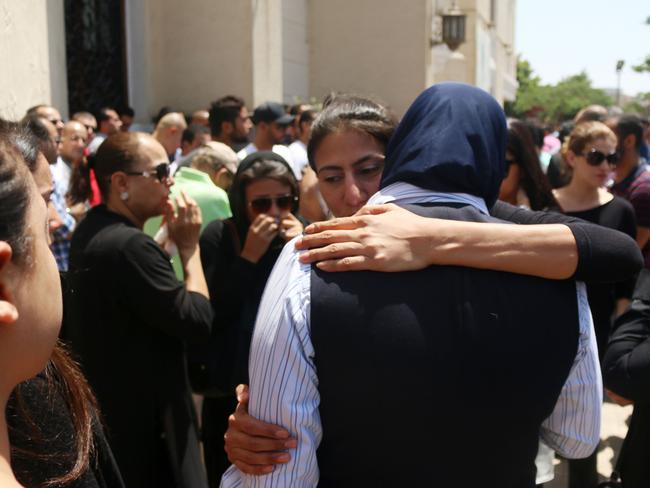 Relatives and friends of passengers of the EgyptAir plane that crashed comfort each other.