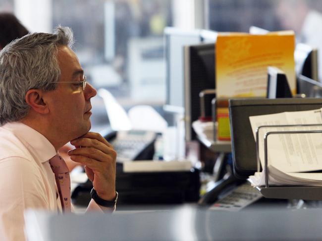 Stockbrokers on the trading floor of Wilson HTM suffering another day of carnage on the markets following Wall Street's capitulation overnight.