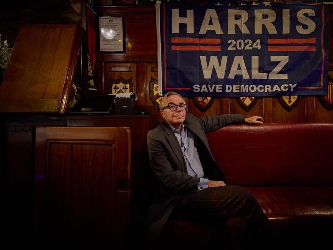 A patron sits beneath a Kamala Harris election flag as he watches coverage of the US presidential election at Harry's Bar during an electoral night event following the US presidential election, in Paris on November 5, 2024. The bar, which claims to be the birthplace of the Bloody Mary and favourite haunt of US writer Ernest Hemingway, prides itself on having correctly predicted the outcome of the US Presidential election all but three times in one hundred years with its traditional "straw poll". The poll which first started in 1924 to give Americans living in Paris, who at the time could not vote by proxy, the opportunity to take part in a ballot. (Photo by Kiran RIDLEY / AFP)