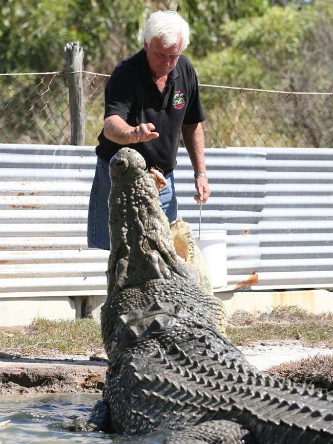 John Lever pictured feeding one of his large crocodiles.