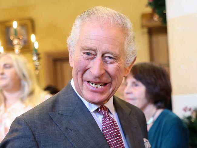 Britain's King Charles III reacts whilst holding a cup and saucer, as he meets with guests during a 75th birthday party for him, hosted by the Prince's Foundation, at Highgrove House in Tetbury, western England on November 13, 2023. Guests included local residents who have been nominated by friends and family and individuals and organisations also turning 75 in 2023. (Photo by Chris Jackson / POOL / AFP)
