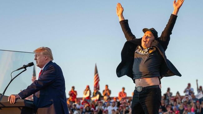 Exhibit B in my growing “Elon Musk just does weird stuff when he’s on stage” file. This is when he bounced around behind Mr Trump like a kid at a birthday party who’s had too much cordial. Picture: Jim Watson/AFP