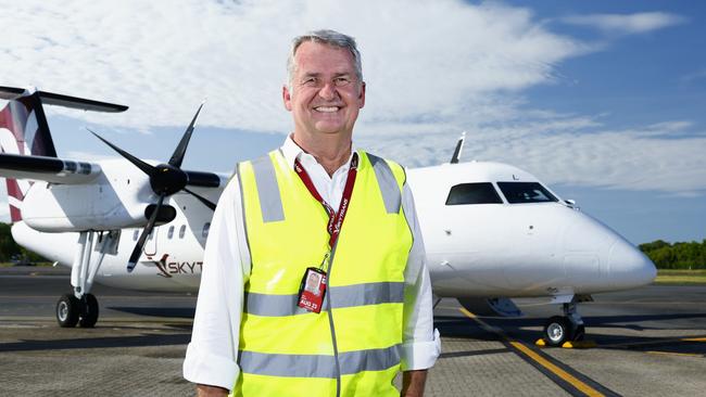 Skytrans CEO Alan Milne in front of a Dash 8-300 turbo prop aircraft. Picture: Brendan Radke