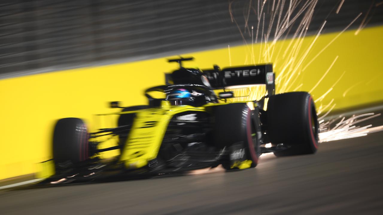 Sparks fly behind Daniel Ricciardo during qualifying in Singapore.