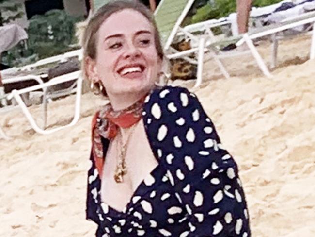 ONE TIME WEB USE ONLY _ FEE APPLIES FOR REUSE - AU_1831119 - ANGUILLA, UNITED KINGDOM  -  BGUK_1831090 -   *PREMIUM-EXCLUSIVE*  - *DO NOT USE UNLESS FEE AGREED* *PICTURES TAKEN ON 02 JAN 2020*British Singer Adele shows off dramatic weight loss while pictured with Harry Styles and Tv presenter James Corden on Holiday together in Anguilla!The superstar singer was seen at Blanchard's beach shack on Meads Bay beach along with her security guard and a large group of friends, the group had lunch together and sang songs until sunset. Adele looked in great spirits as she enjoyed drinks on the beach and showed off her slimmer figure in pattern dress and red Neck scarf!Pictured: AdeleBACKGRID Australia 7 JANUARY 2020 BYLINE MUST READ: JOE BROWN / BACKGRIDPhone: + 61 419 847 429Email:  sarah@backgrid.com.au