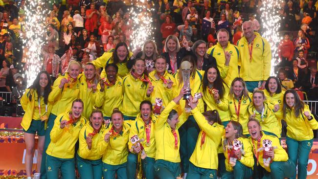 TOPSHOT - Australian players hold their trophy as they celebrate winning the final of the Netball World Cup against England, in Cape Town on 06 August 2023. (Photo by RODGER BOSCH / AFP)