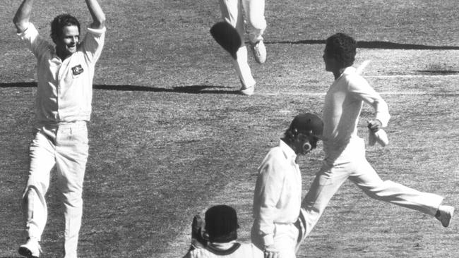 Geoff Dymock throws his arms up after dismissing David Gower LBW at the MCG.