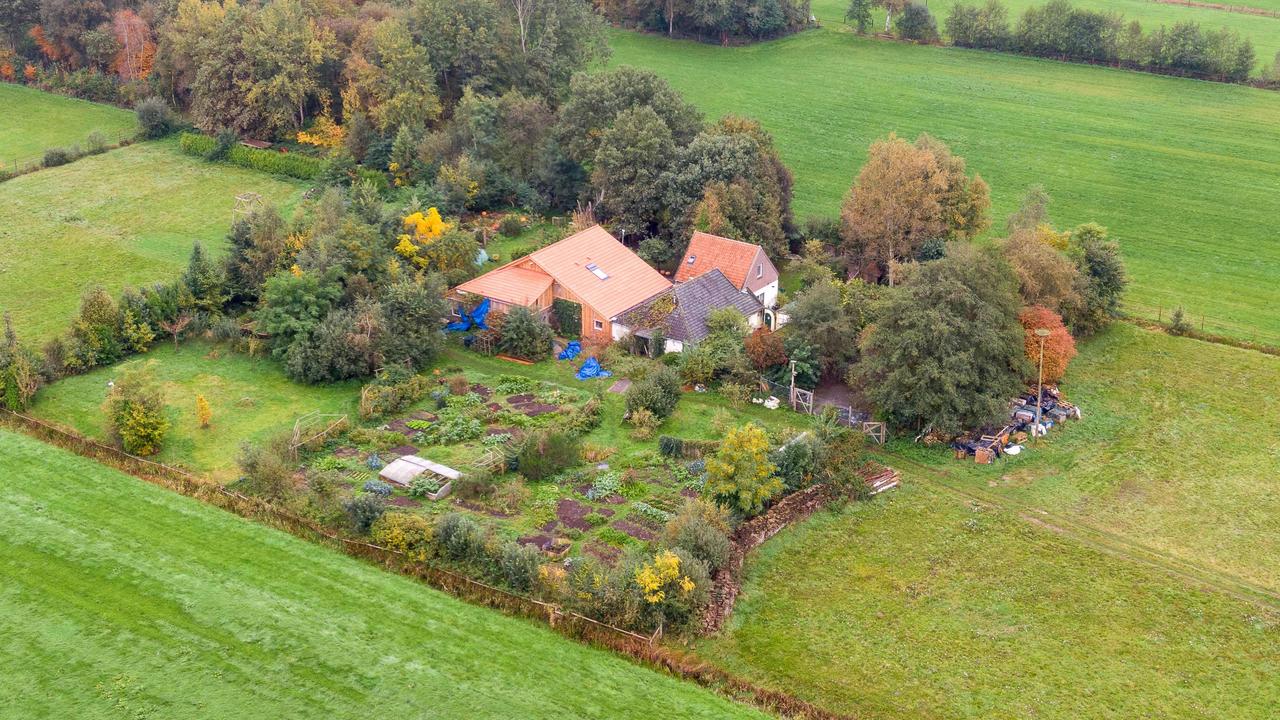 The family was found at this farmhouse, reportedly "waiting for the end of time". Picture: Wilbert Bijzitter/ANP/AFP)