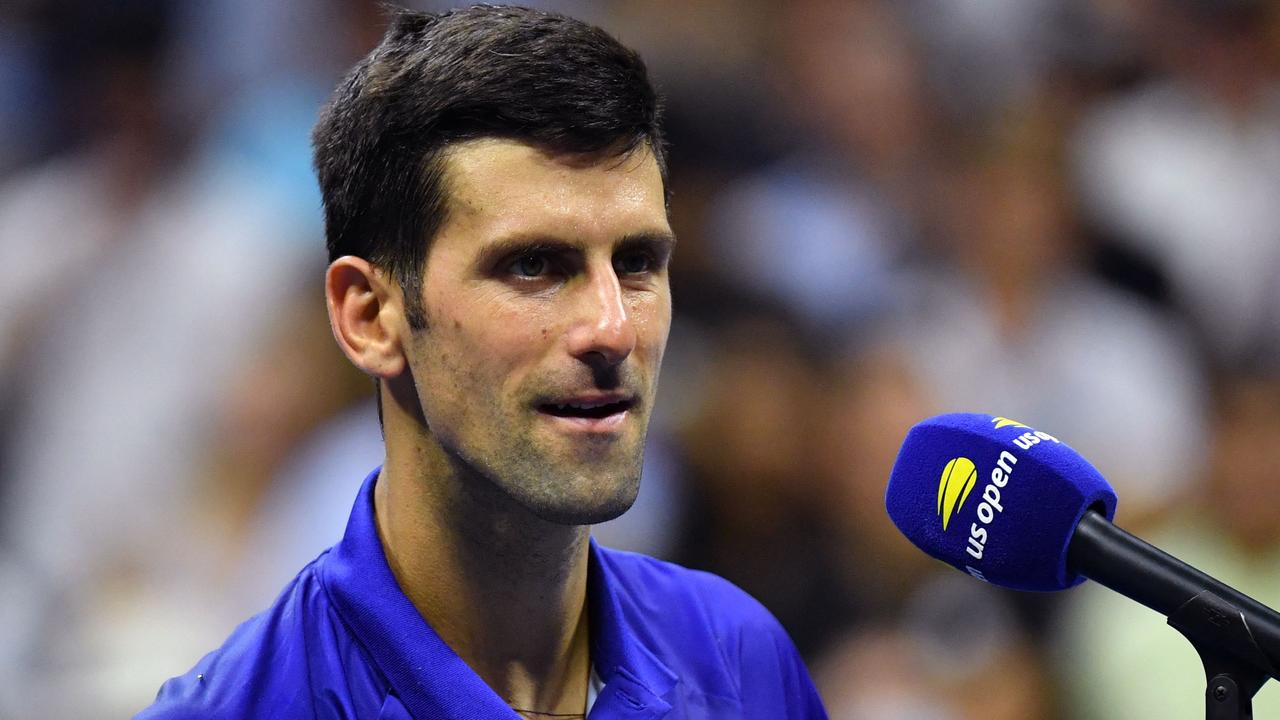 Serbia's Novak Djokovic speaks on the court after winning his 2021 US Open Tennis tournament men's singles first round match against Denmark's Holger Rune at the USTA Billie Jean King National Tennis Center in New York, on August 31, 2021. (Photo by ANGELA WEISS / AFP)