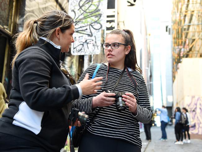 Canon’s Erin Kostopulos (left) dishes out some advice during the SnapMelbourne workshop. Picture: Josie Hayden