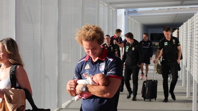 AFL players from Richmond and the Western Bulldogs arrive at the Gold Coast Airport with their families before heading to their hotels. Picture Glenn Hampson