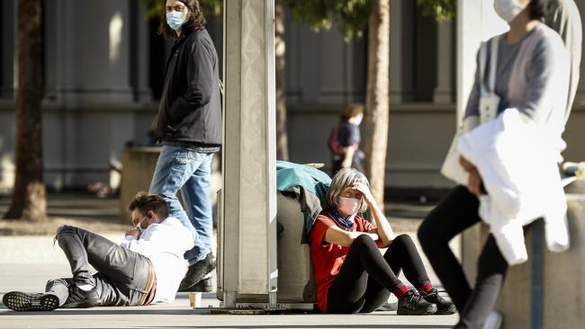 People line up outside the Covid-19 vaccination hub at the Royal Exhibition Building in Carlton, Melbourne on Thursday. Picture: Getty Images