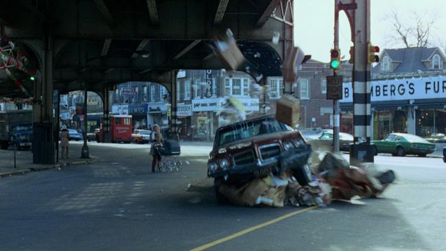 Popeye’s car hits a pile of rubbish.