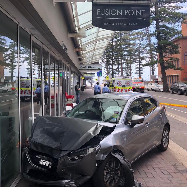 A car ended up just centimetres from a popular Manly eatery, Fusion Point, after its driver suffered a medical episode and lost control of the vehicle in Wentworth St, near Rialto Ln. Picture: Jim O'Rourke