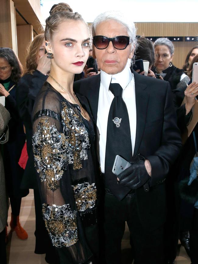 Model Cara Delevingne and Lagerfeld attend the Chanel Spring Summer 2016 in Paris. Picture: Rindoff/Le Segretain/Getty Images