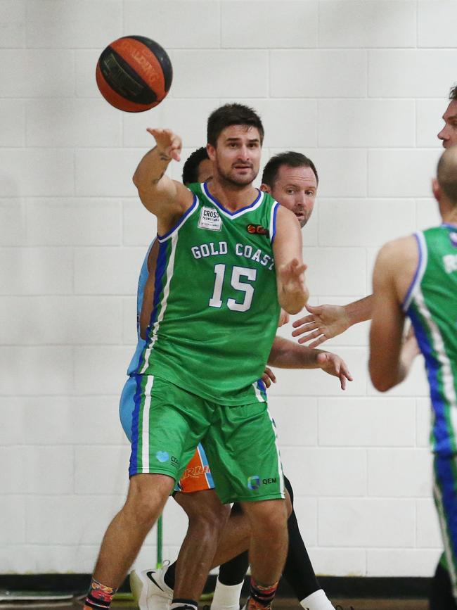 Action from the Queensland Basketball League (NBL) match between the Cairns Marlins and the Gold Coast Rollers, held at Early Settler Stadium, Cairns. Rollers captain Christian Salecich makes a pass surrounded by Marlins players. PICTURE: BRENDAN RADKE